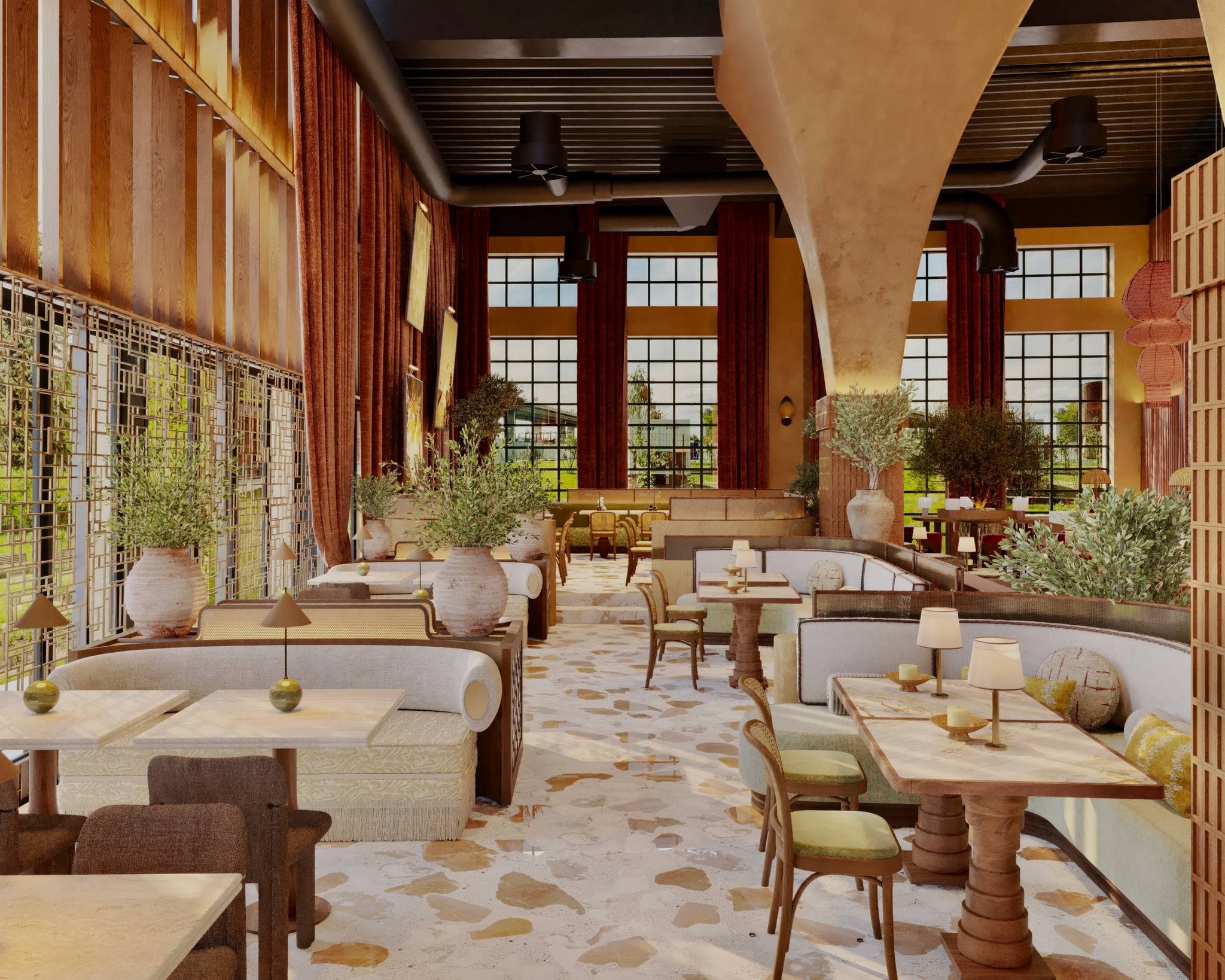 The dining room by day: cream banquettes, marble tables and olive trees in clay pots beneath tall steel-framed windows